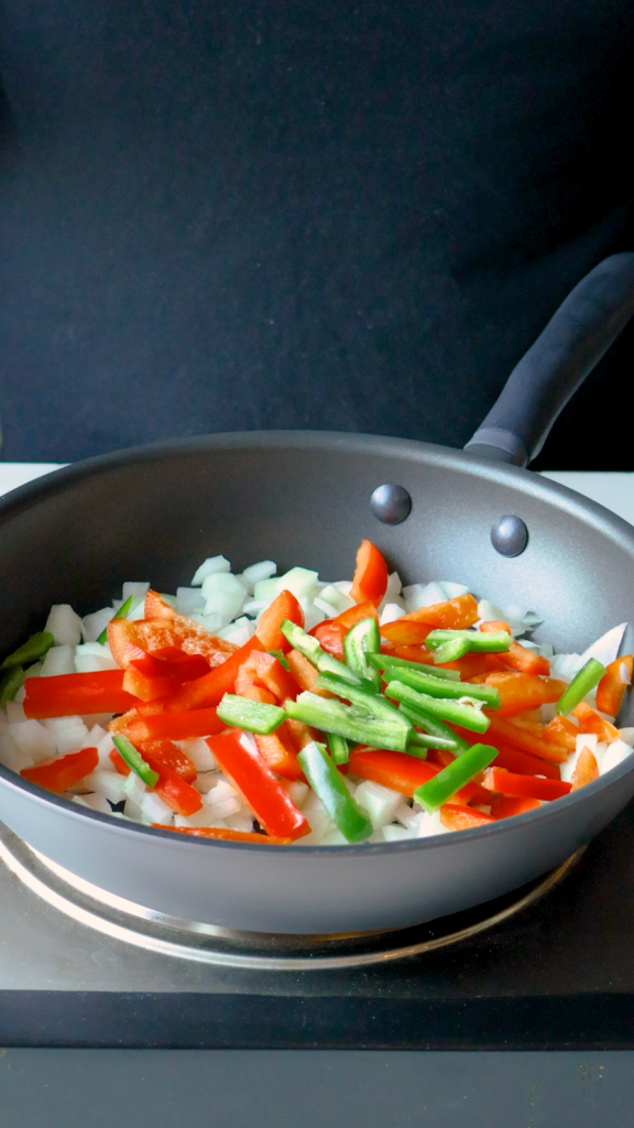 Then add in the bell pepper and jalapenos